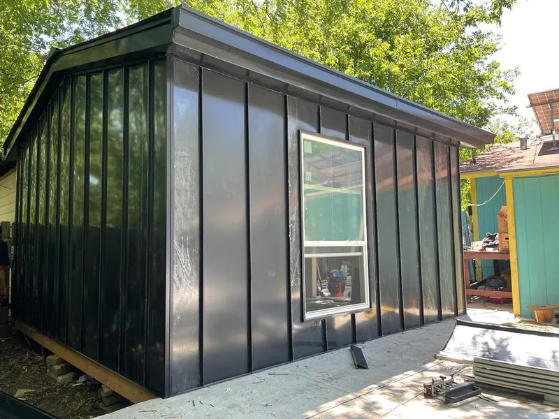 Black standing seam metal wall panels for Roof Inspection in North Hempstead