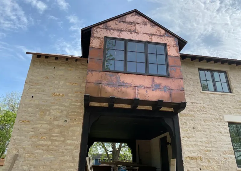 Copper metal panel facade on a stone building for Skylight Installation in North Hempstead